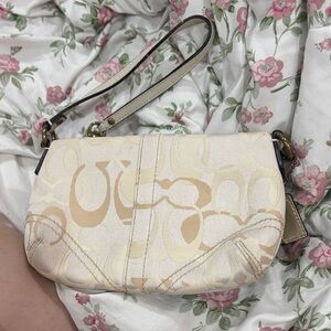 COACH Elegant Cream Patterned Wristlet